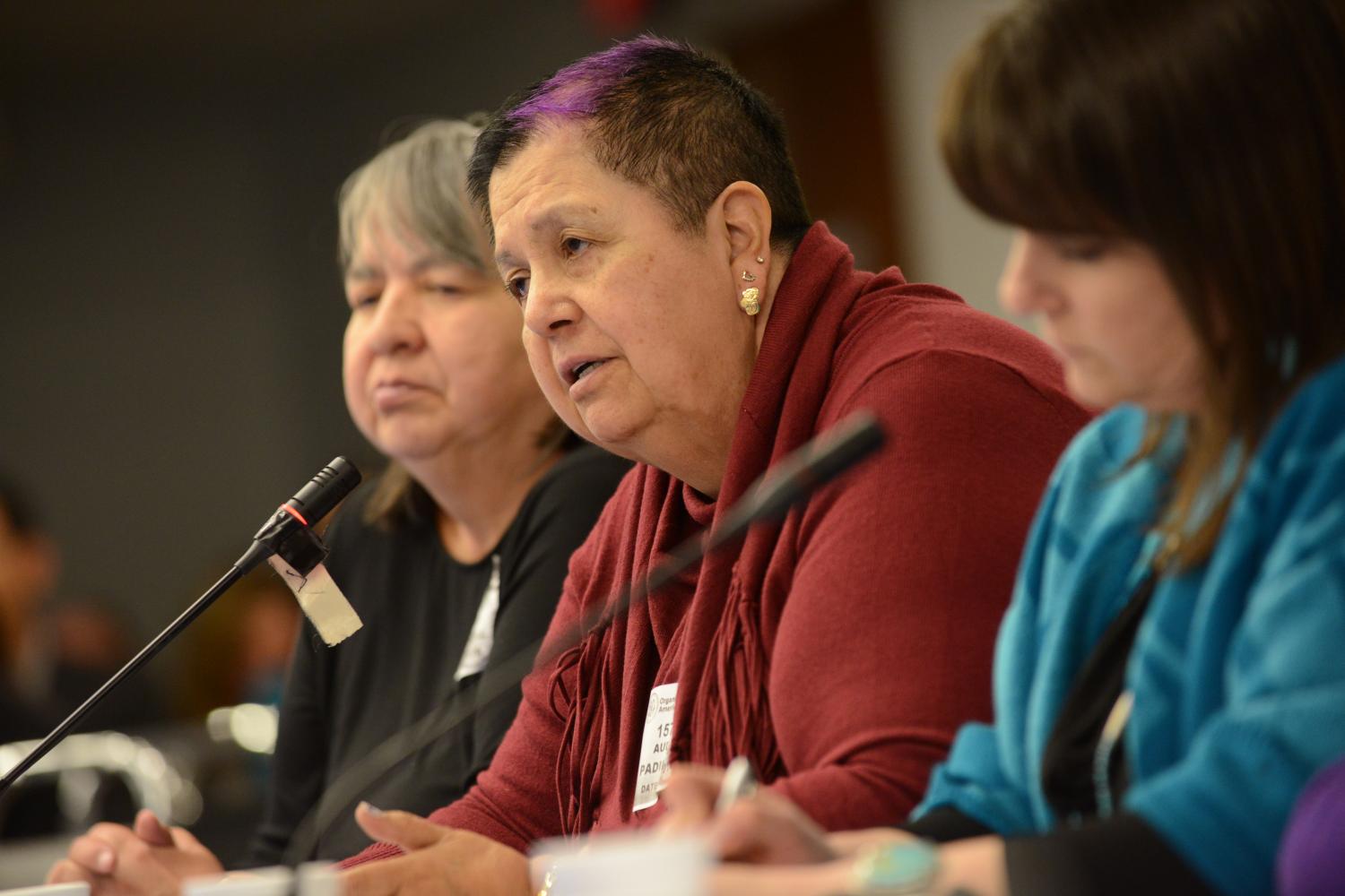 Sharon McIvor talking at the microphone during a hearing about missing and murdered Indigenous women in British Columbia, held by the Inter-American Commission on Human Rights.