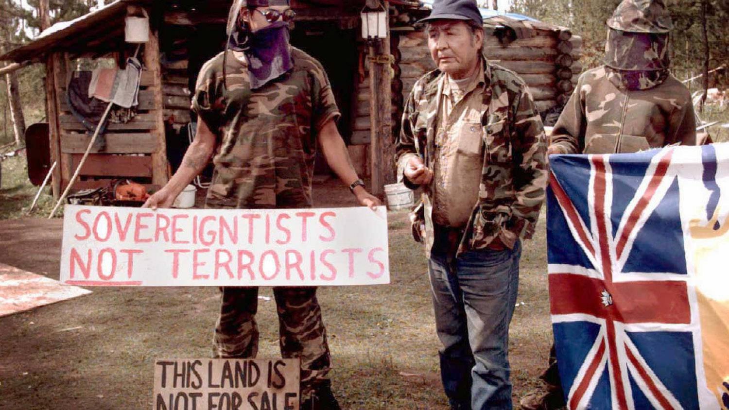 Ts'Peten Defenders, including Wolverine on the right, outside of their camp by Gustafsen Lake in 1995.