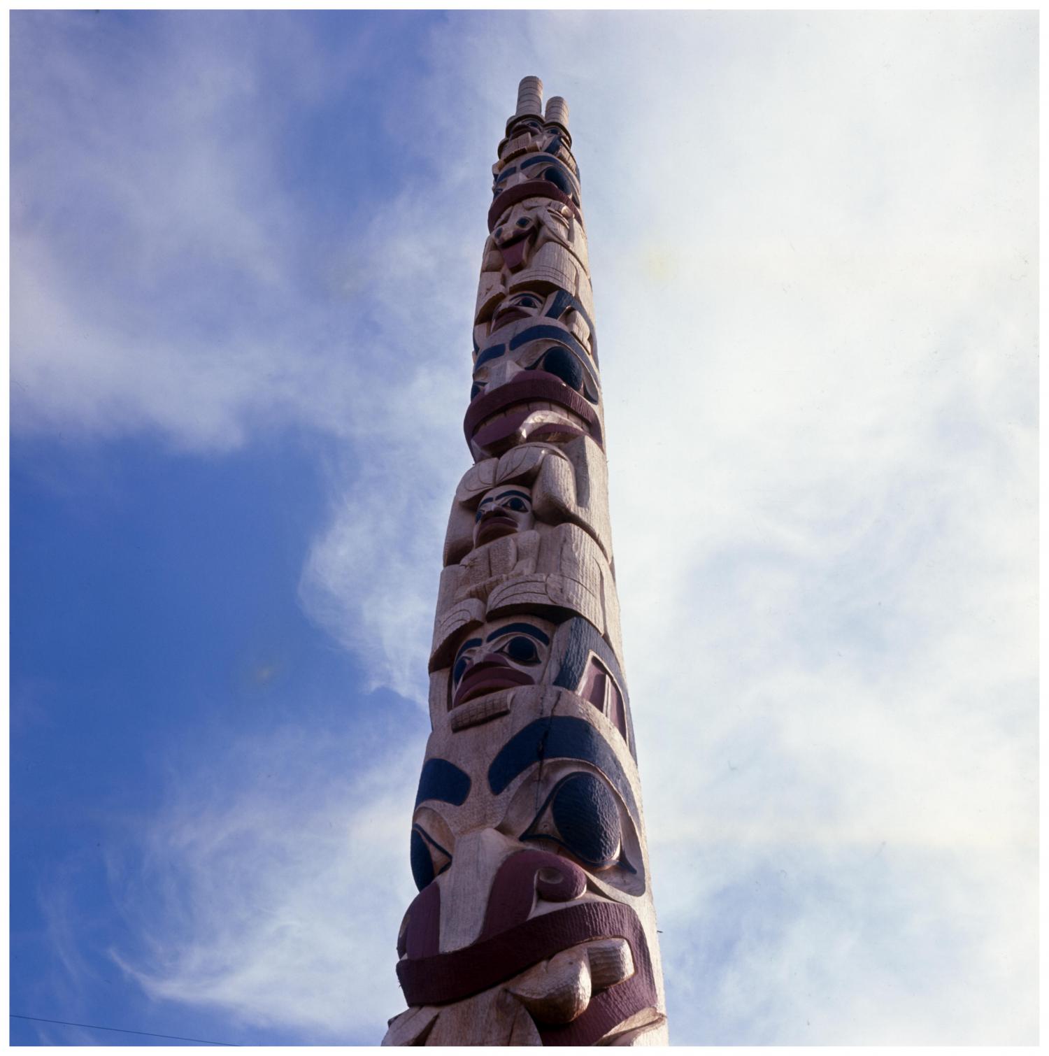 Image taken at a pole raising ceremony in Masset. The pole was carved by Robert Davidson, Jr. This image shows the pole after it has been erected.