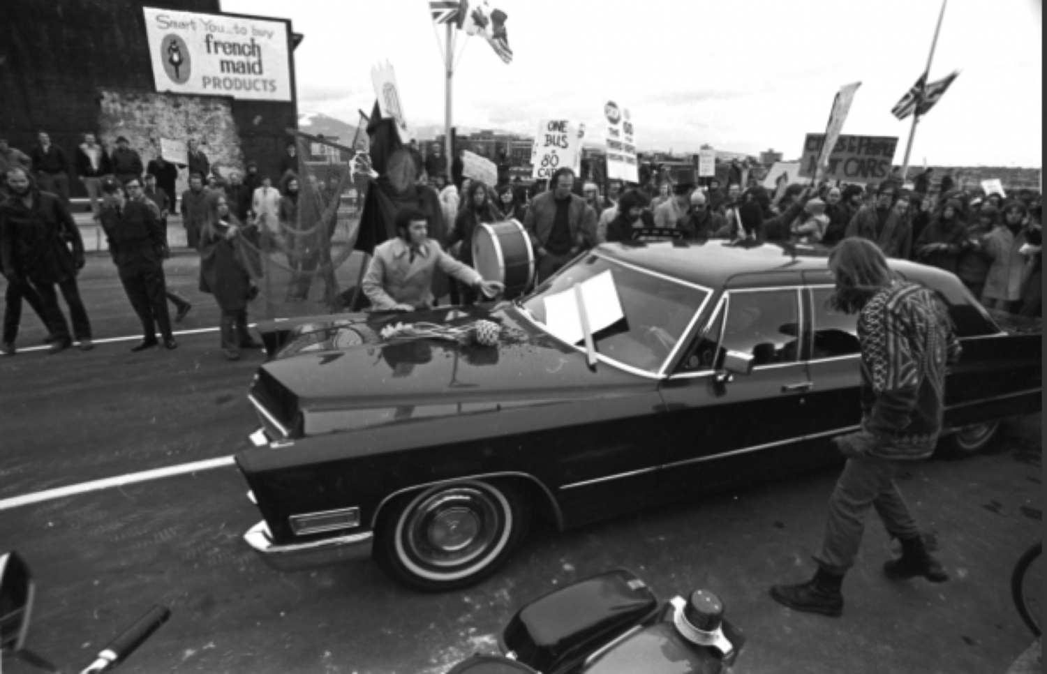 Vancouver Mayor Tom Campbell’s limo edges through a crowd of protesters at the opening of the Georgia Viaduct Jan. 9, 1972.