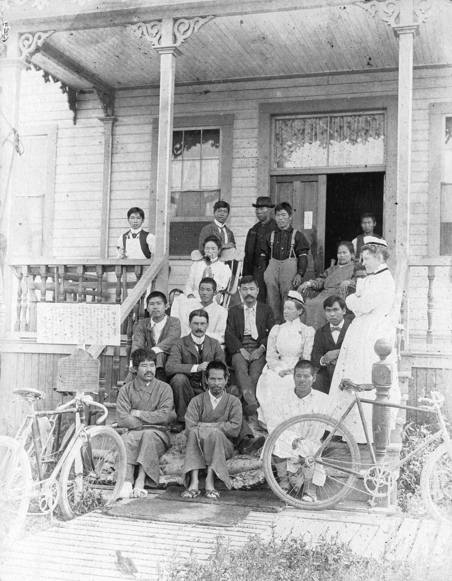 Photograph depicts a group of nurses and patients on the front steps of the Japanese Hospital in Steveston.
