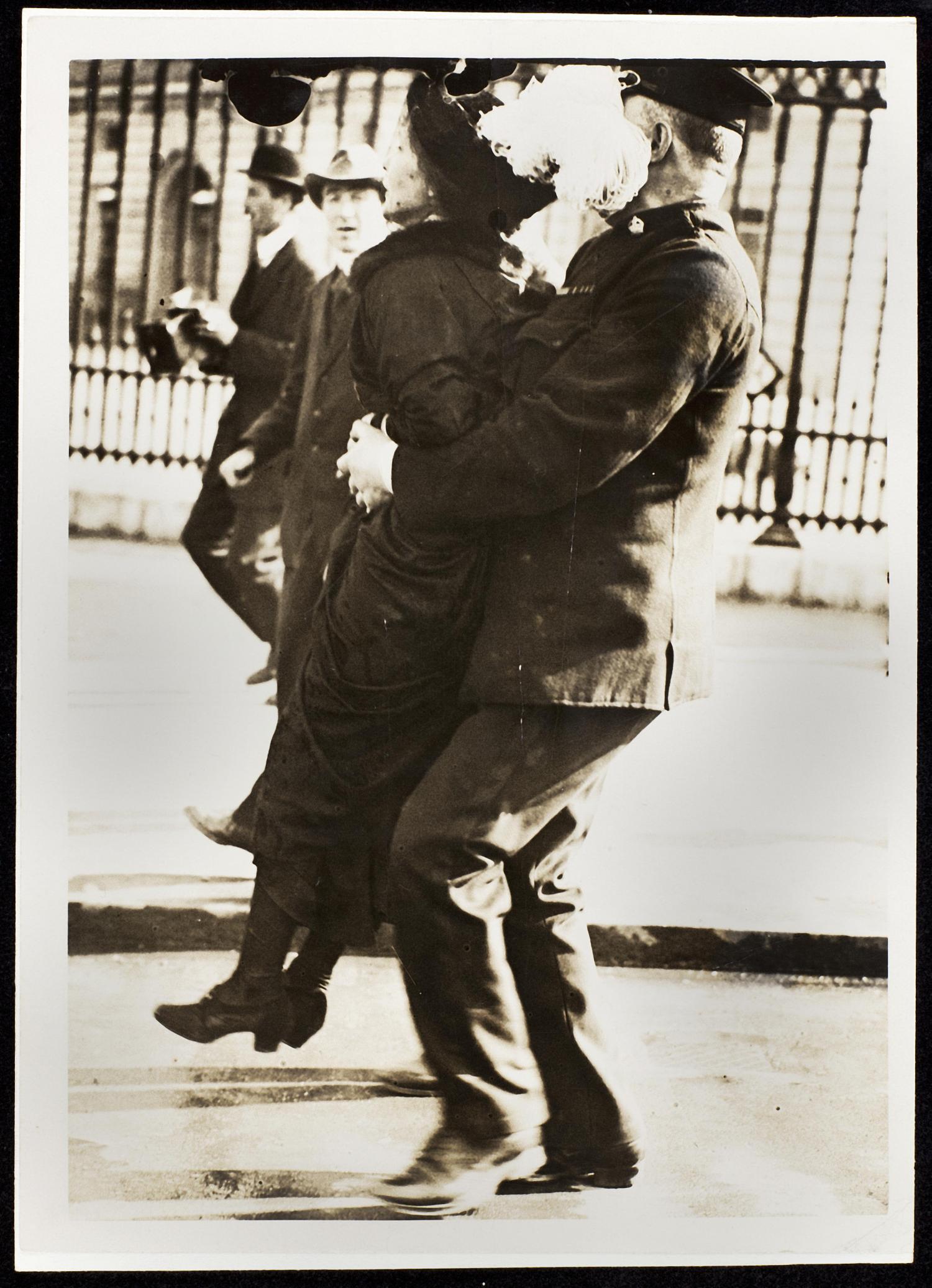 The leader of the Women's Suffragette movement, Mrs Emmeline Pankhurst is arrested by Superintendant Rolfe outside Buckingham Palace, London while trying to present a petition to HM King George V in May 1914.