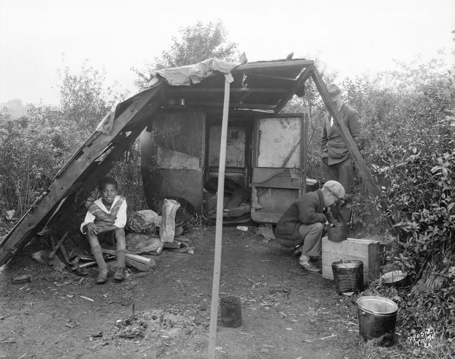 Three men in shelter in the 'Jungle' at the City dump