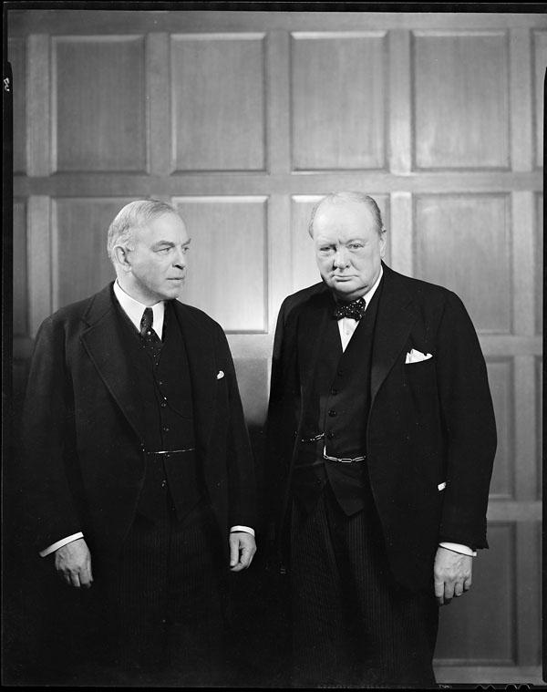 William Lyon Mackenzie King looks at Winston Churchill as the British prime minister peers into the camera in December 1941.