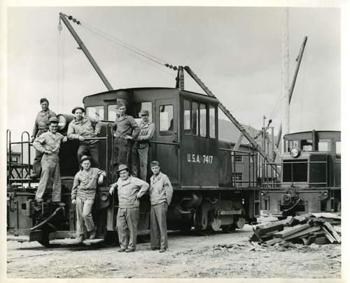 U.S. soldiers in Prince Rupert posing on a train engine during WWII.