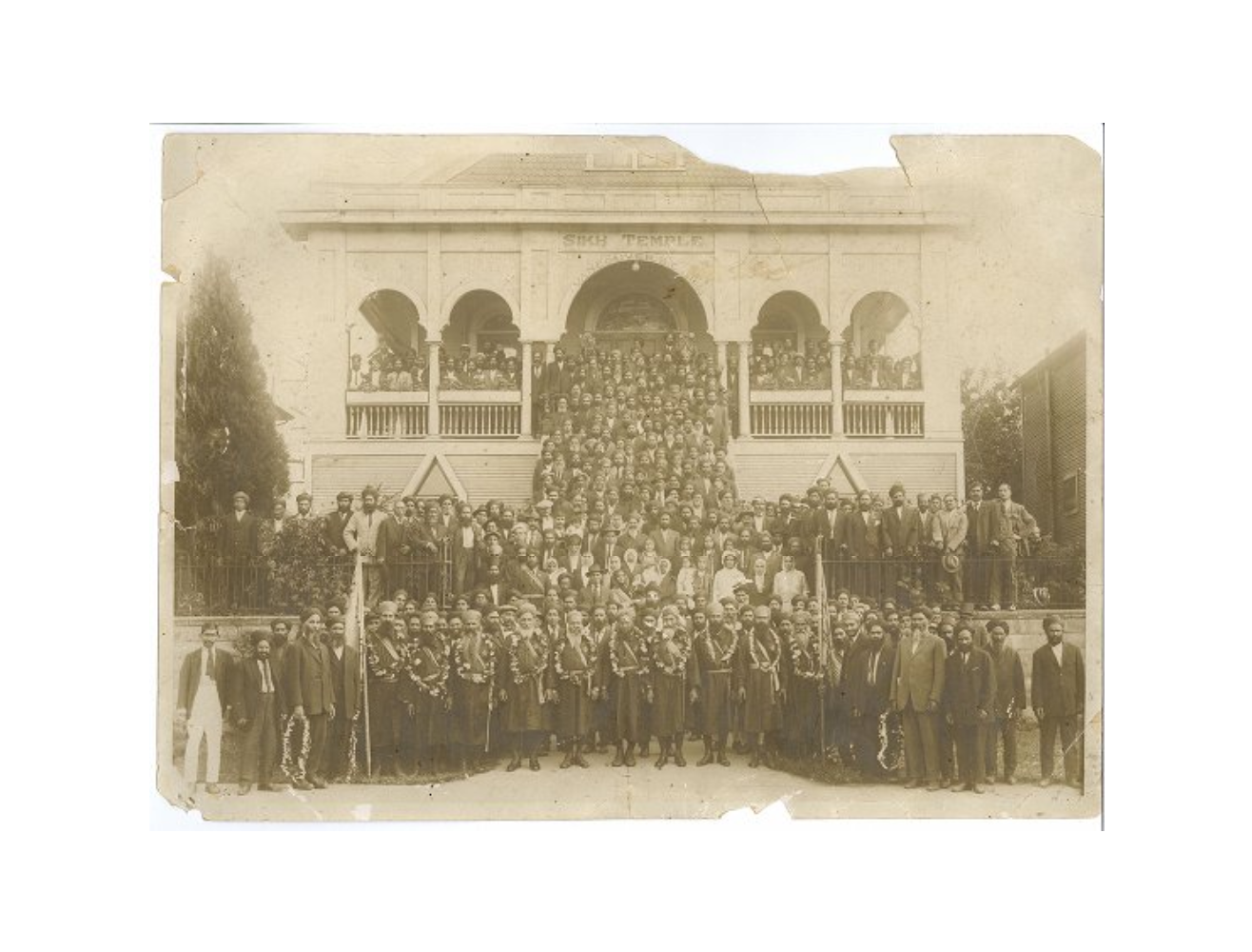 Group in front of 2nd Avenue Temple, Vancouver, with men in military dress
