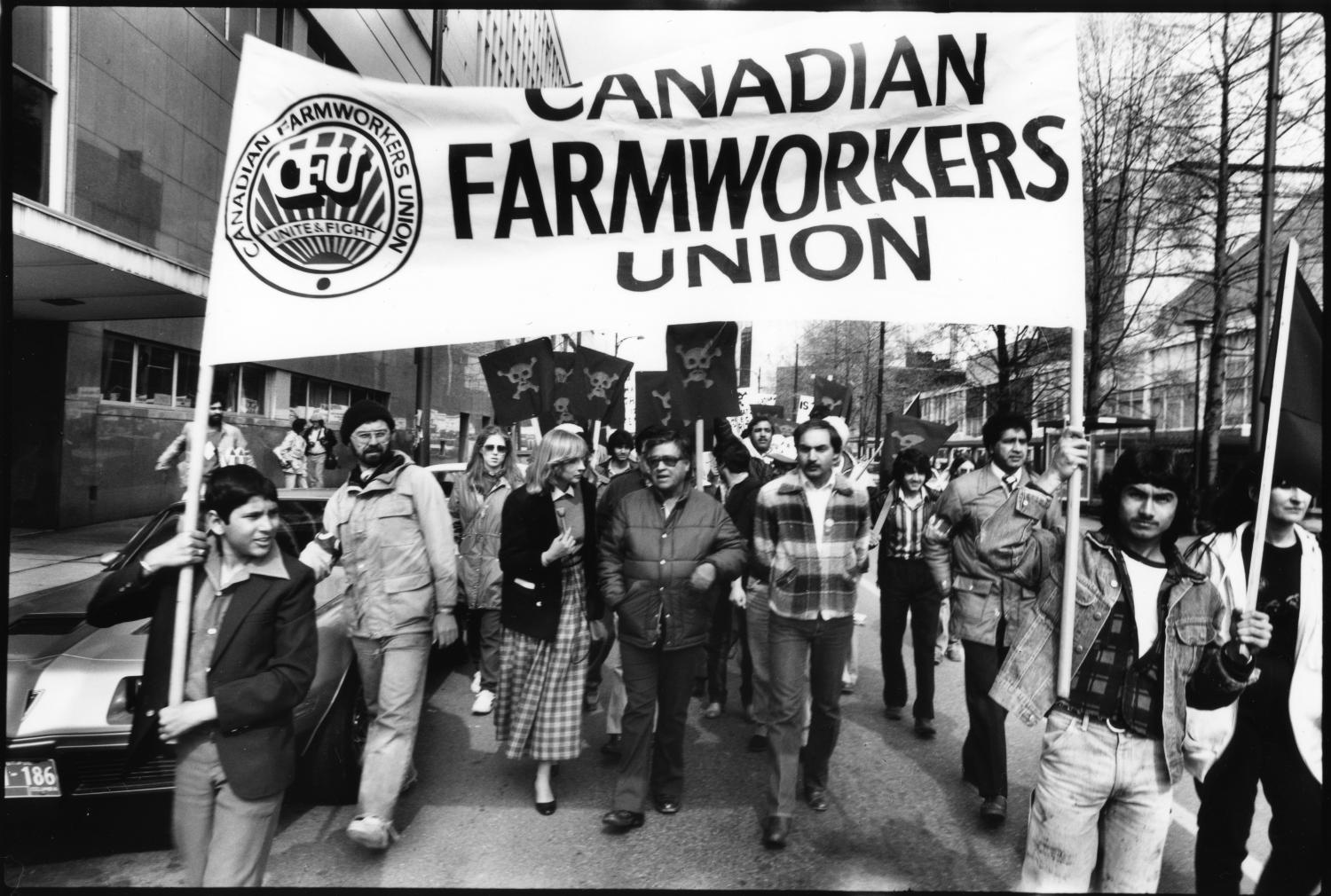 The legendary union leader Cesar Chavez, president of the United Farm Workers’ of America (UFW) (center left) and Raj Chouhan, founding president of the Canadian Farmworkers’ Union (CFU) (center right) lead a major rally [...] on Cambie Street.