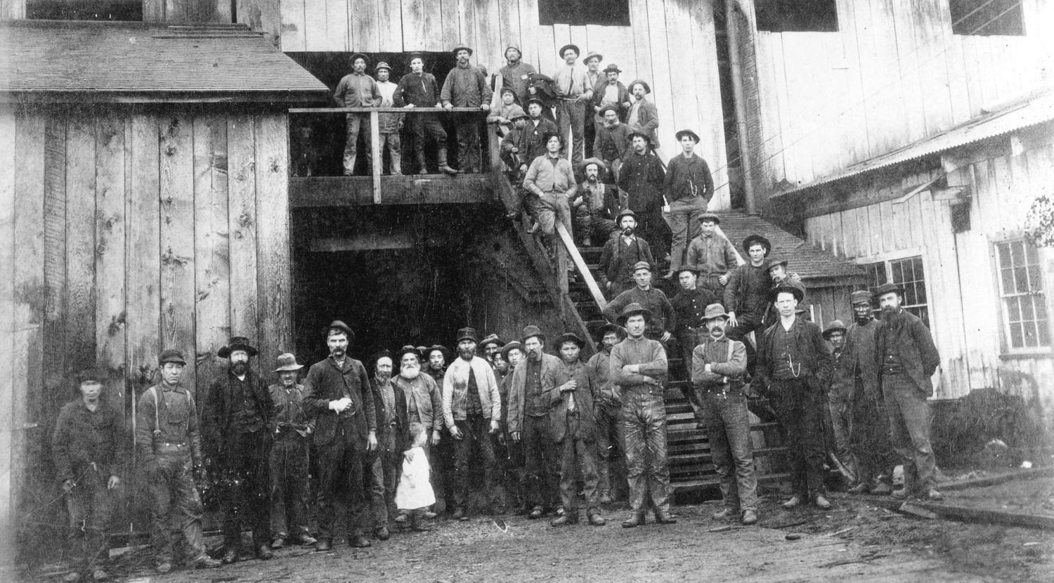 Workers outside the mill in 1889. 