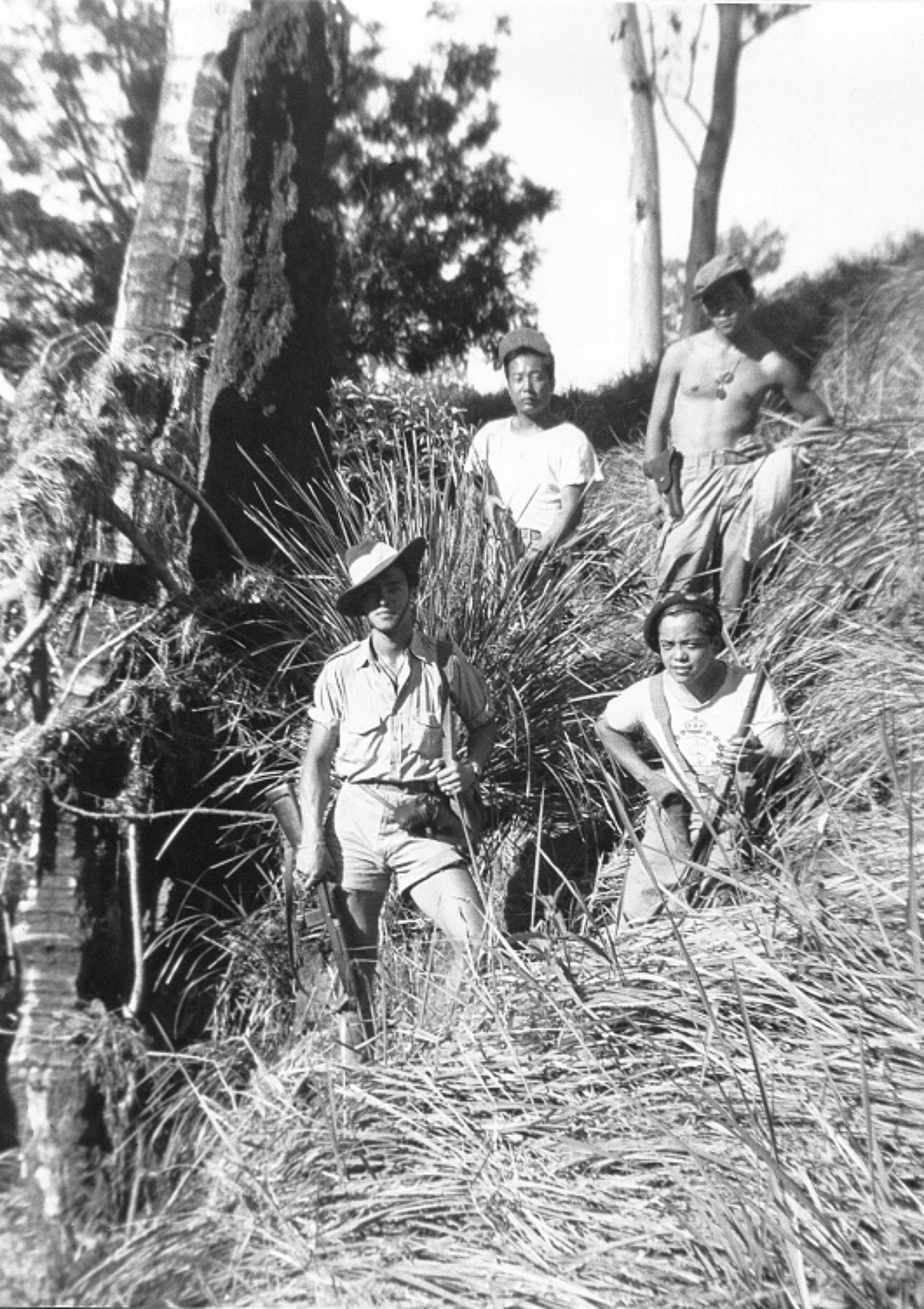 Force 136 recruits in the jungles of Southeast Asia. Back row (left to right): Harden Lee and Dick Lam. Front row: Ed Fong and George Fong.