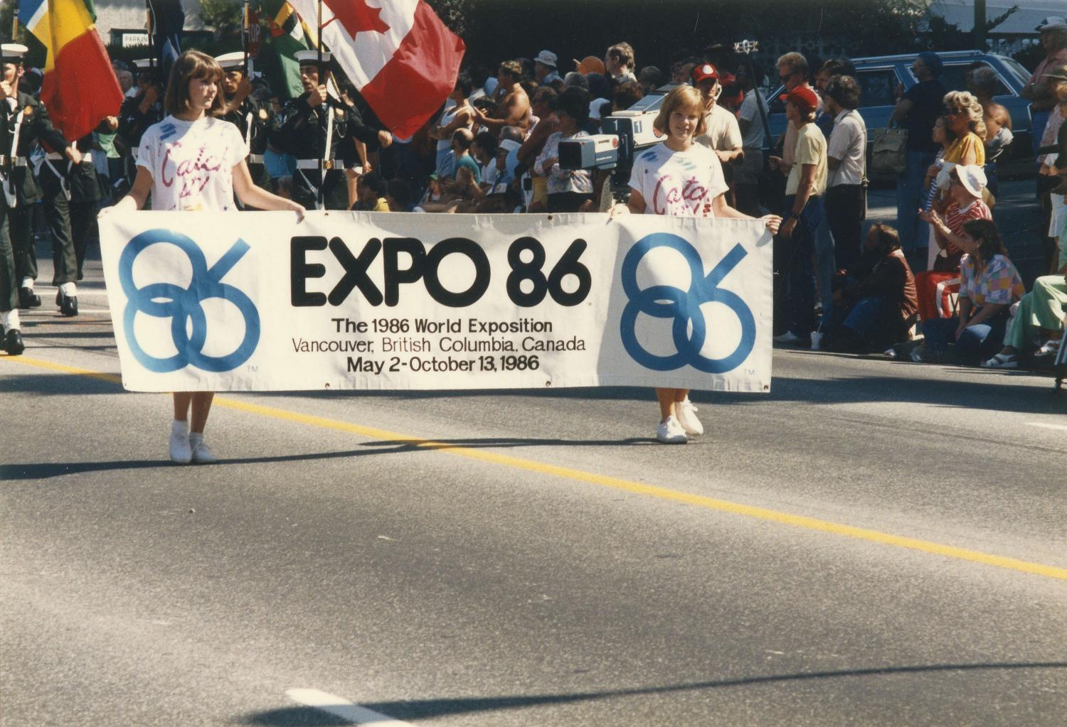 Girls carrying Expo 86 banner.