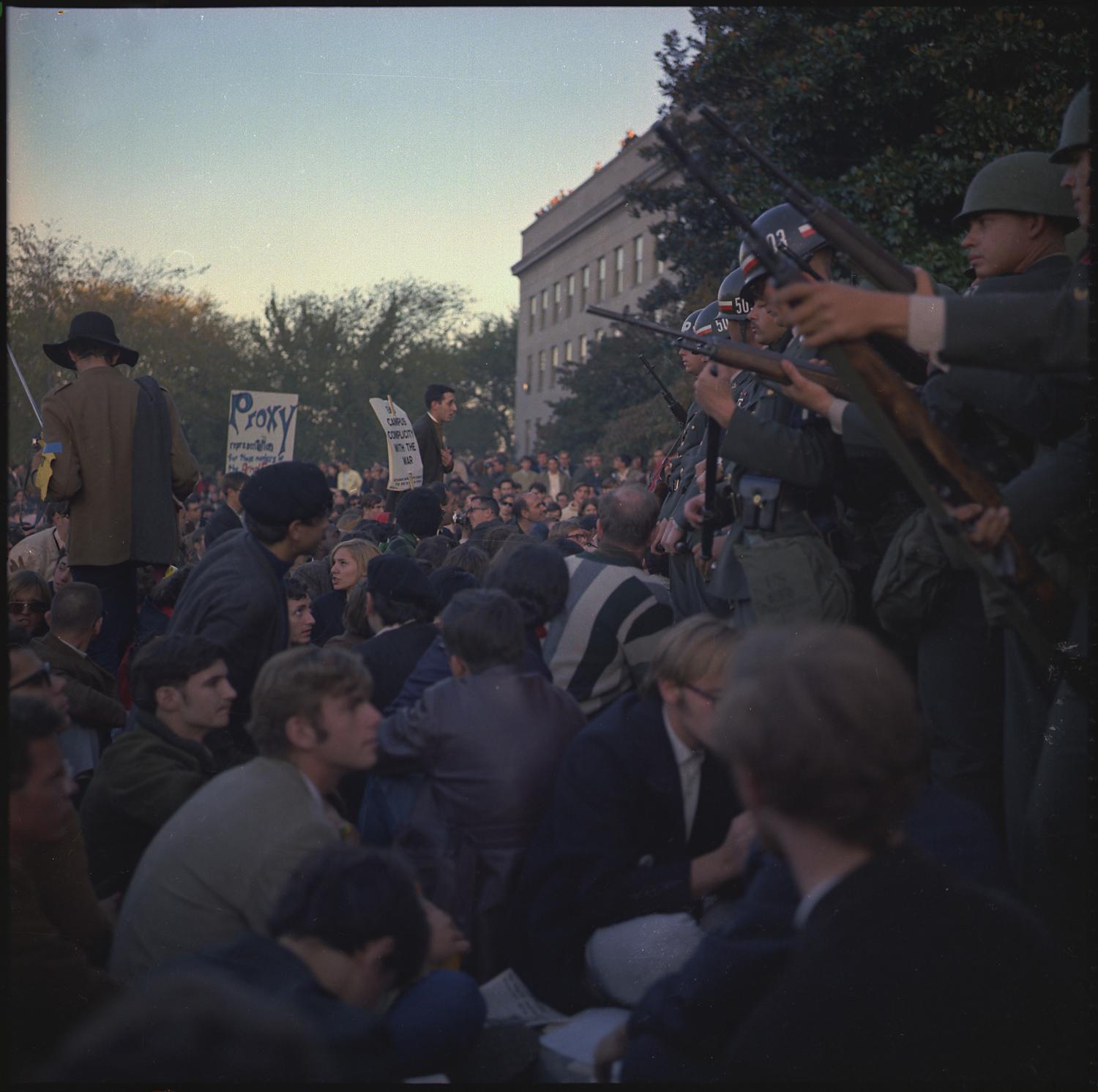 Members of the military police keep back protesters during their sit-in at the Mall Entrance to the Pentagon.