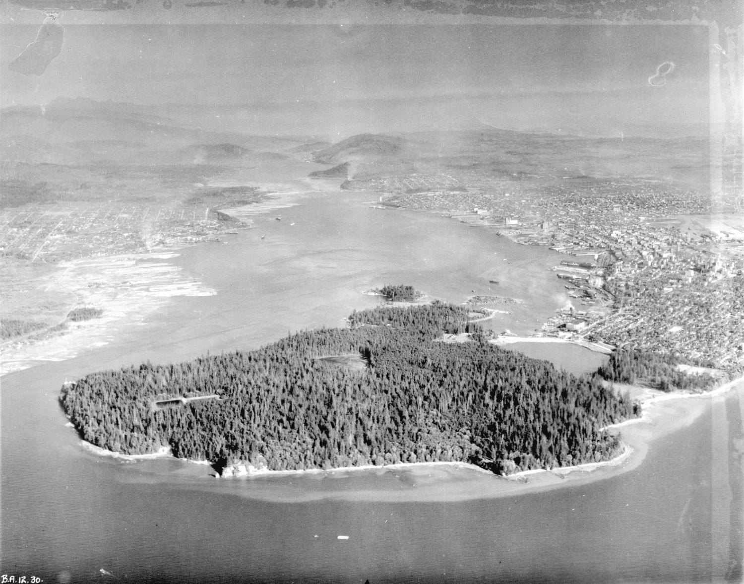 Aerial view looking east over Stanley Park, Coal Harbour and the Burrard Inlet in 1926.