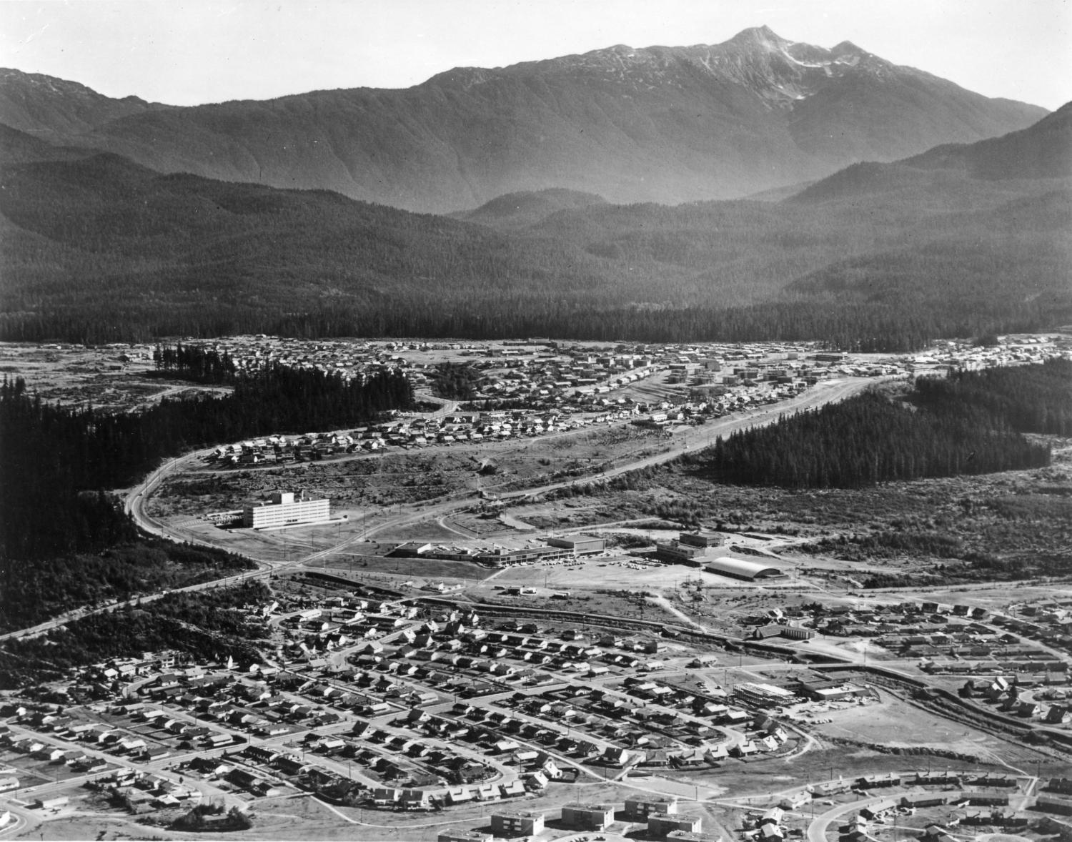 Telephoto depicts the town of Kitimat, an aerial view with Mount Elizabeth in the background, Kildala Neighbourhood in the foreground, and Nechako Neighbourhood.