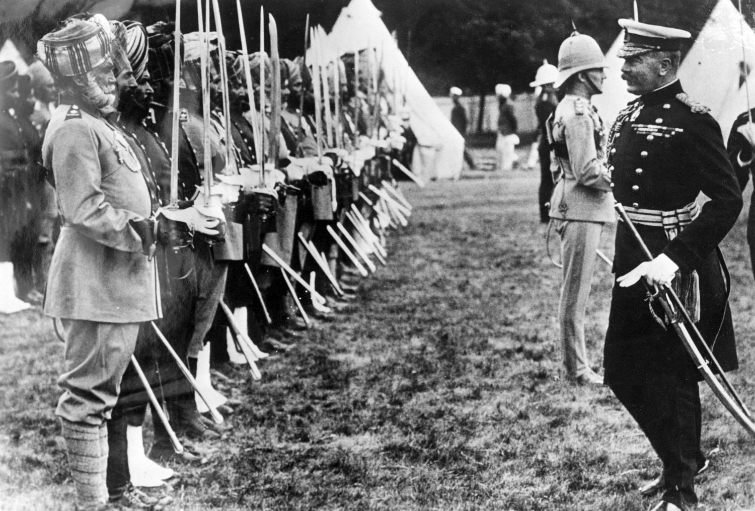 Lord Herbert Kitchener (1850-1916) reviewing Indian troops during the First World War. 800,000 Indian troops fought in the war: nearly 48,000 were killed or missing and 65,000 wounded. 13,000 medals were won, including 12 VCs.