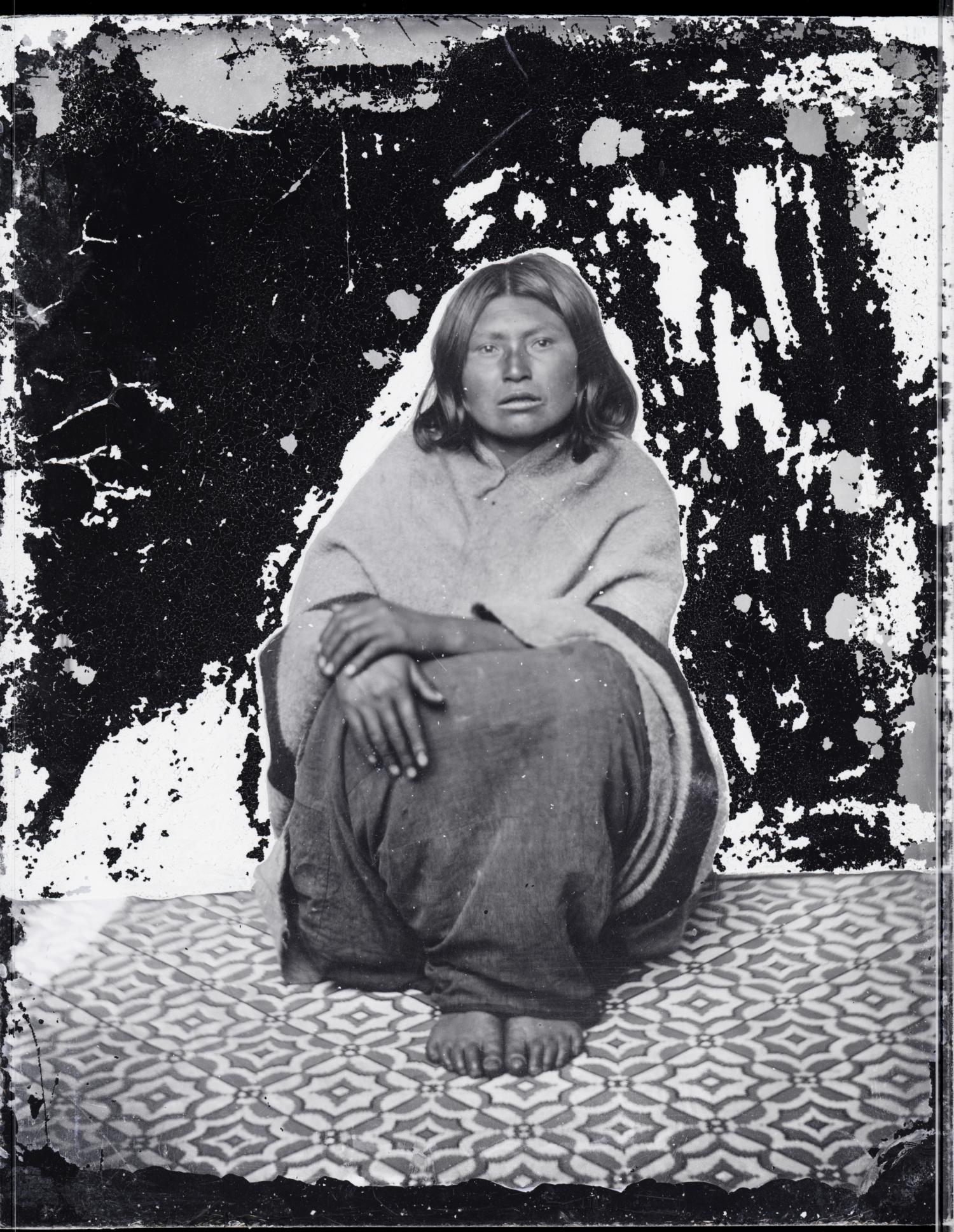 Portrait of an unidentified Indigenous individual seated.