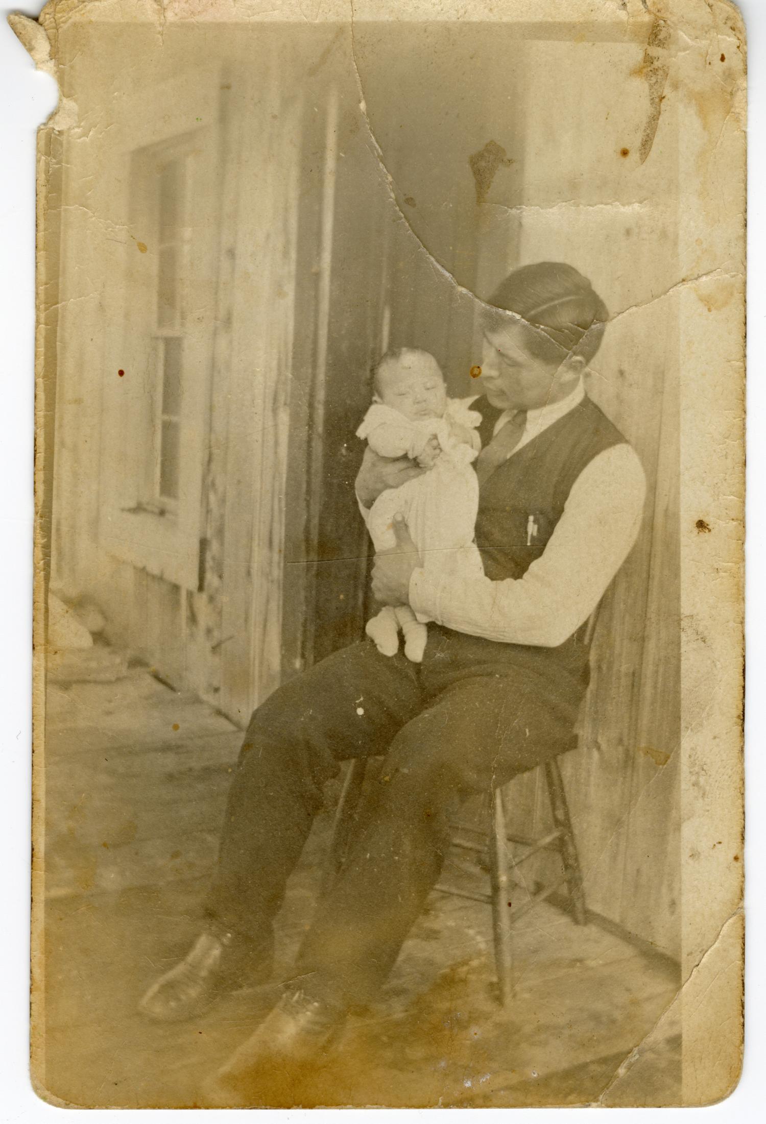 Jack Joseph holding his son, Frank Joseph.