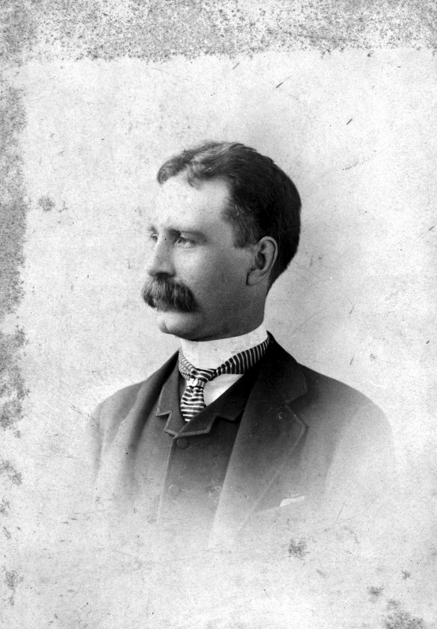 A black and white portrait of Andrew Onderdonk
