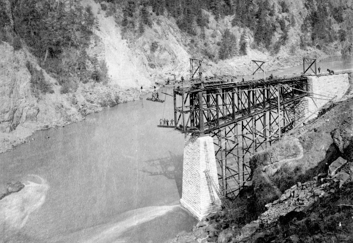 A railway bridge being constructed over a river