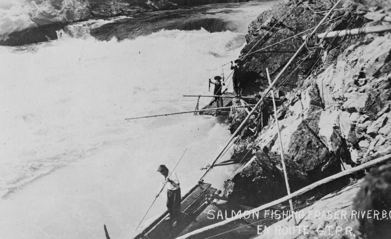 Indigenous men fishing salmon along the Fraser River