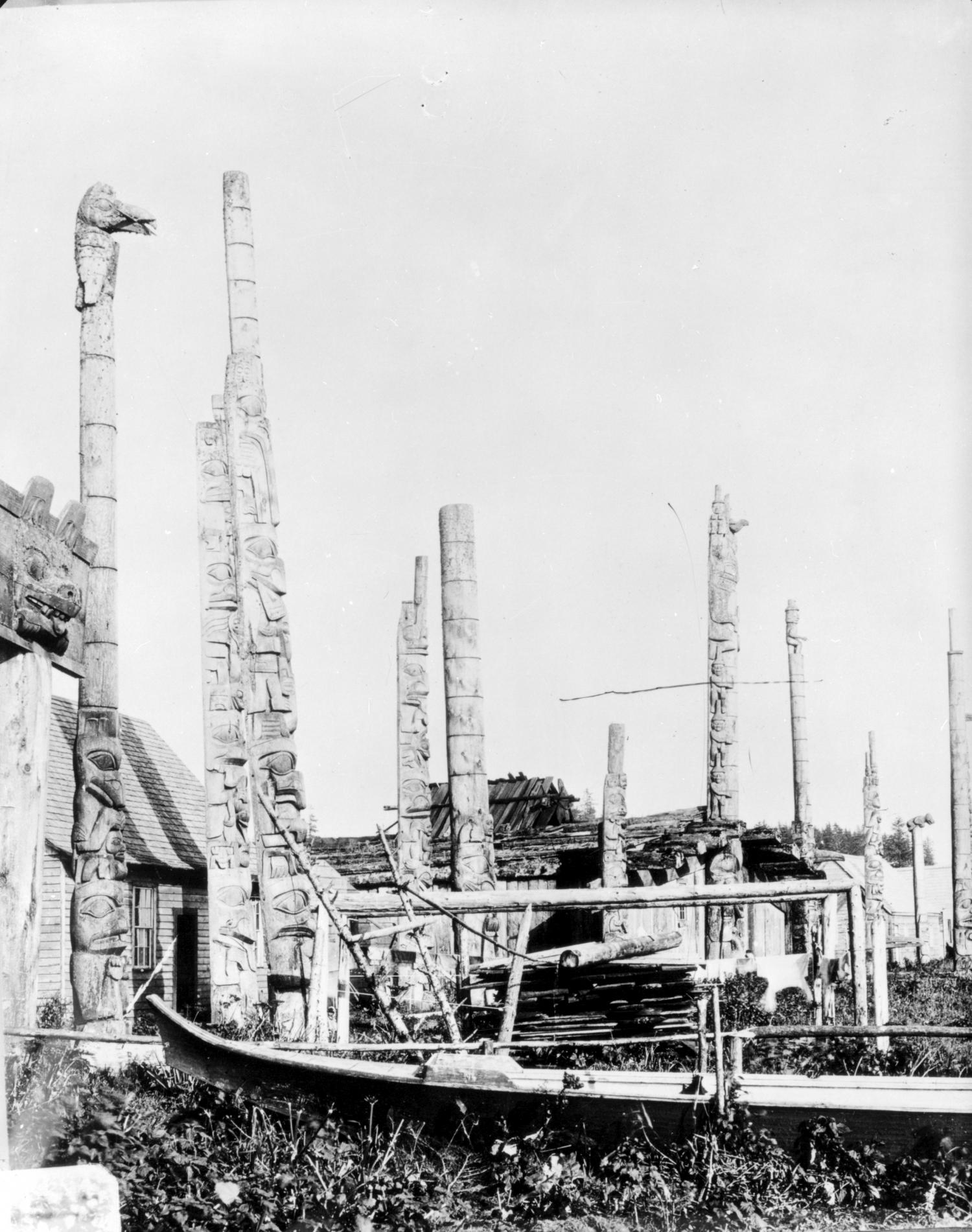 Photo showing lots of totem poles in Masset.