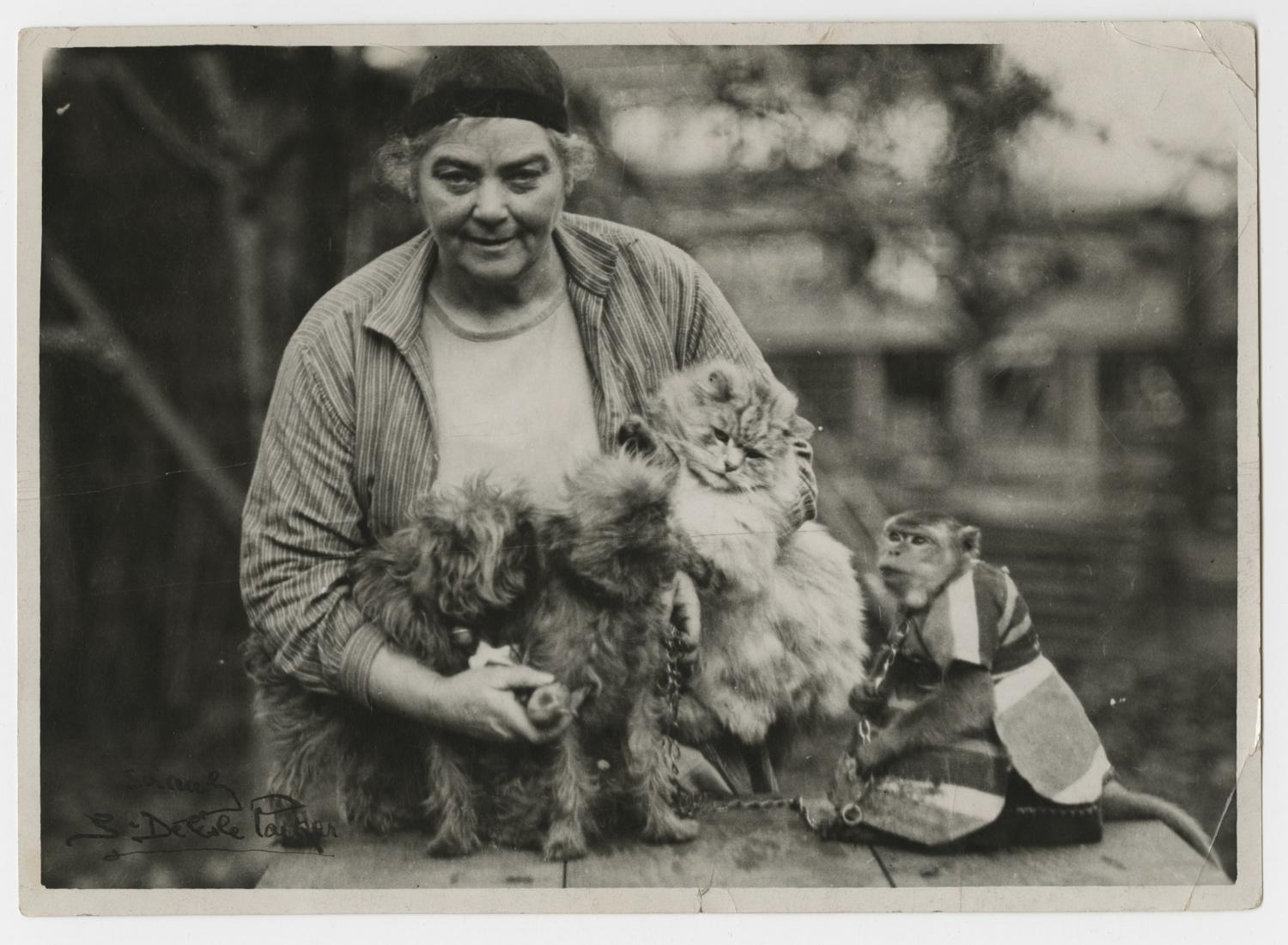 Emily Carr with Woo, Adolphus and two Griffons.