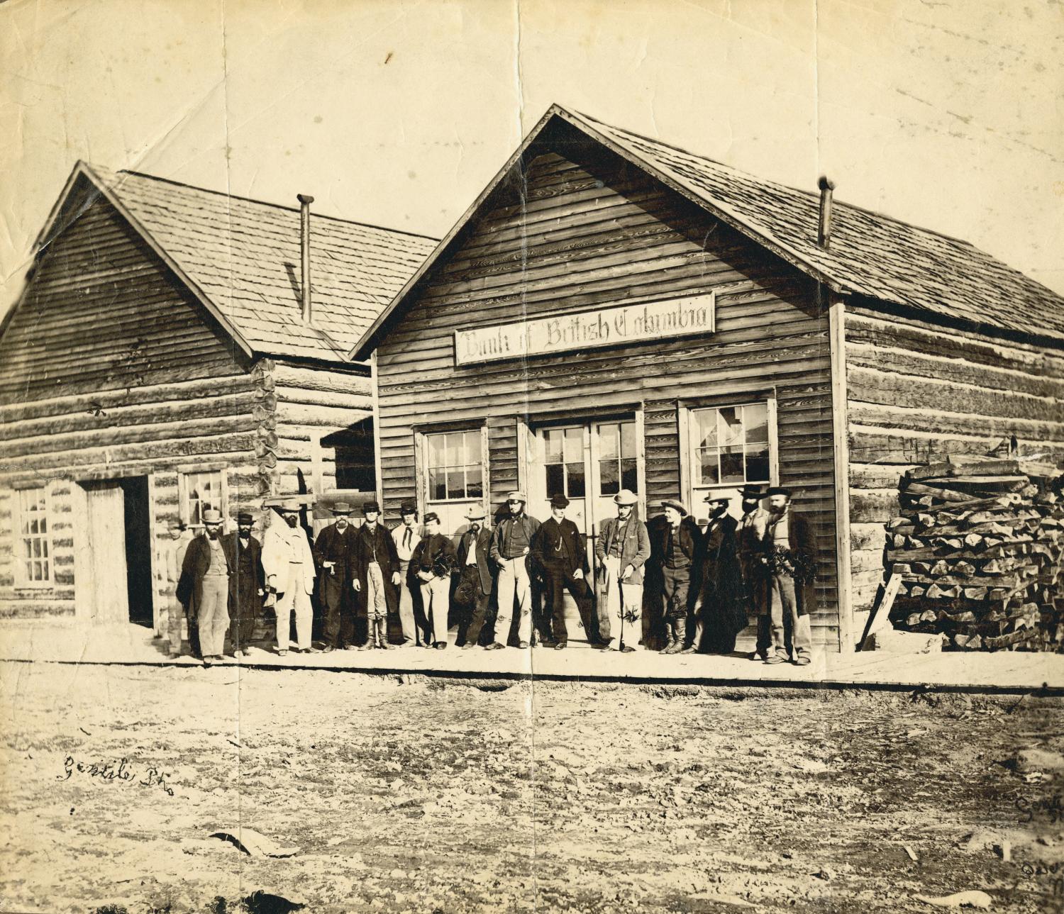 Group of men in front of bank in Quesnel